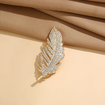 Free gift – vintage golden feather brooch included with every order